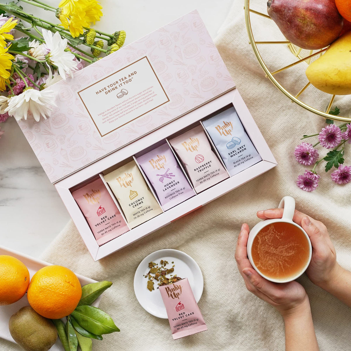 Pinky Up Sample Box displaying 15 single-serve pouches