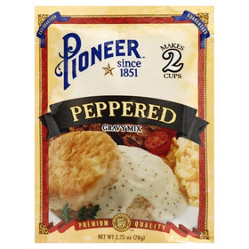 Pioneer Brand Gravy Packets pouring into skillet for rich gravy