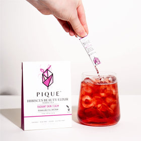 PIQUE Hibiscus Tea Crystals in a steaming cup for a soothing moment