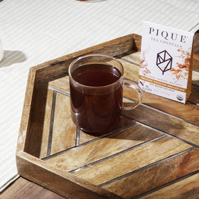PIQUE Organic black tea leaves closeup highlighting premium sourcing