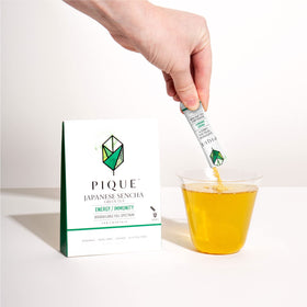 PIQUE Sencha Tea Crystals-dispensed-into-water; vibrant infusion in seconds.