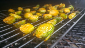 Pit Beast New England BBQ Rub chicken thigh on grill demonstrates versatile seasoning