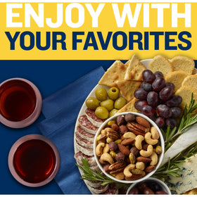 Planters Deluxe Salted Mixed Nuts on a coffee table during movie night.