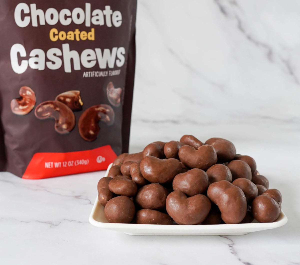 Kosher-certified Platinum Chocolate Coated Cashews label signals quality.