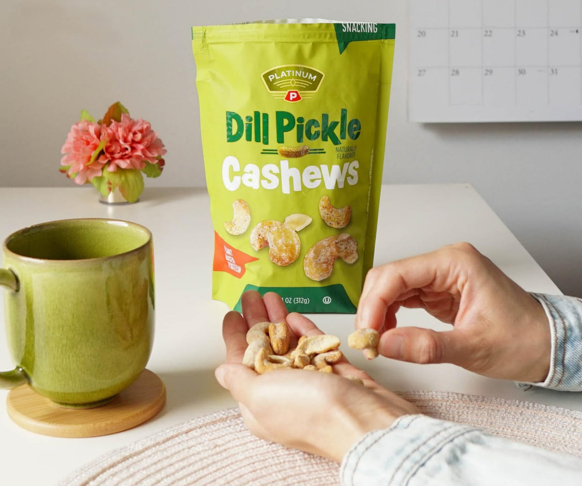 Platinum Dill Pickle Cashews on desk, desk-friendly flavor crunch.