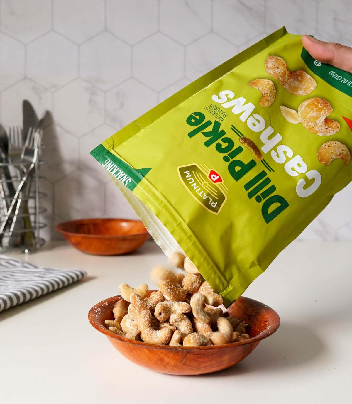Platinum Dill Pickle Cashews serving bowl ready for sharing and tasting.