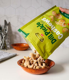 Platinum Dill Pickle Cashews serving bowl ready for sharing and tasting.