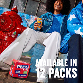 12-pack of Plezi FiZZ Cherry Limeade on a fridge shelf, convenient family option.