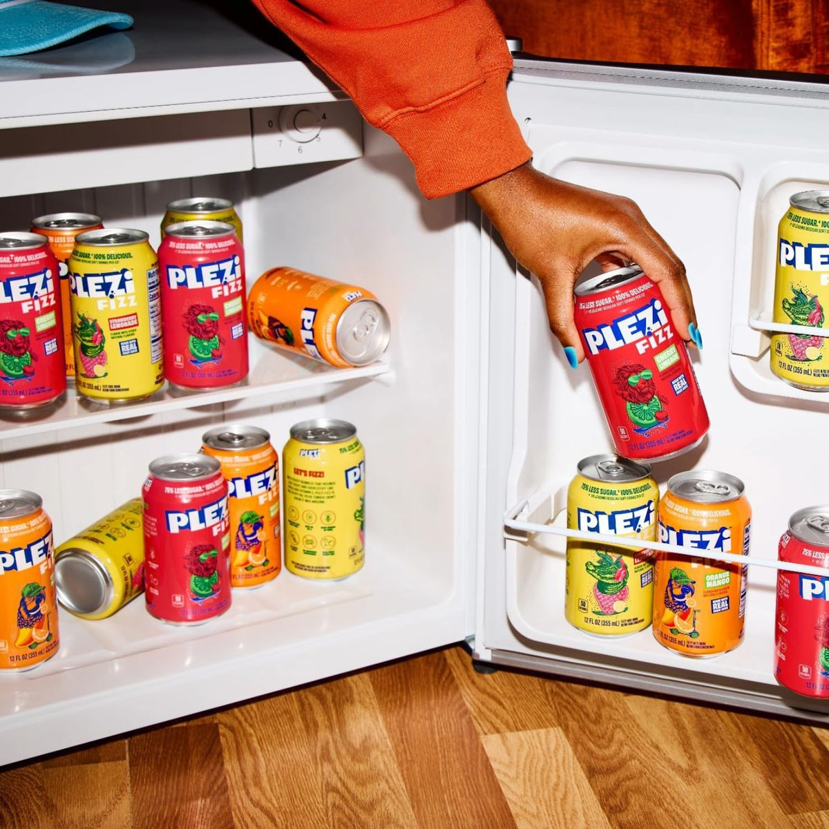 Chilled Plezi FiZZ Cherry Limeade cans in a cool display, ready to sip.