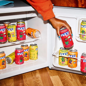 Chilled Plezi FiZZ Cherry Limeade cans in a cool display, ready to sip.