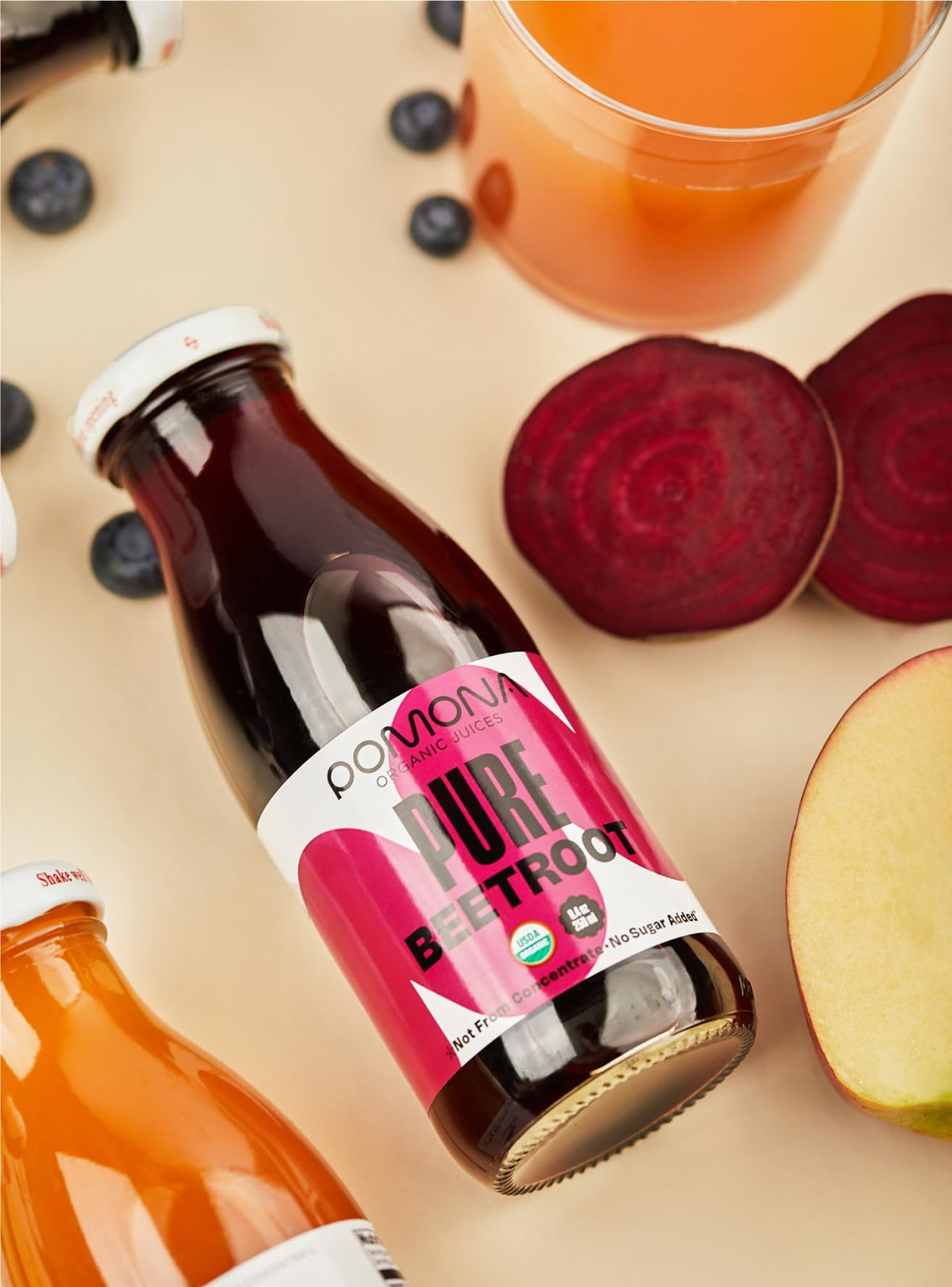 Pomona Organic Beet Juice label closeup highlights non-GMO, kosher, and preservative-free quality