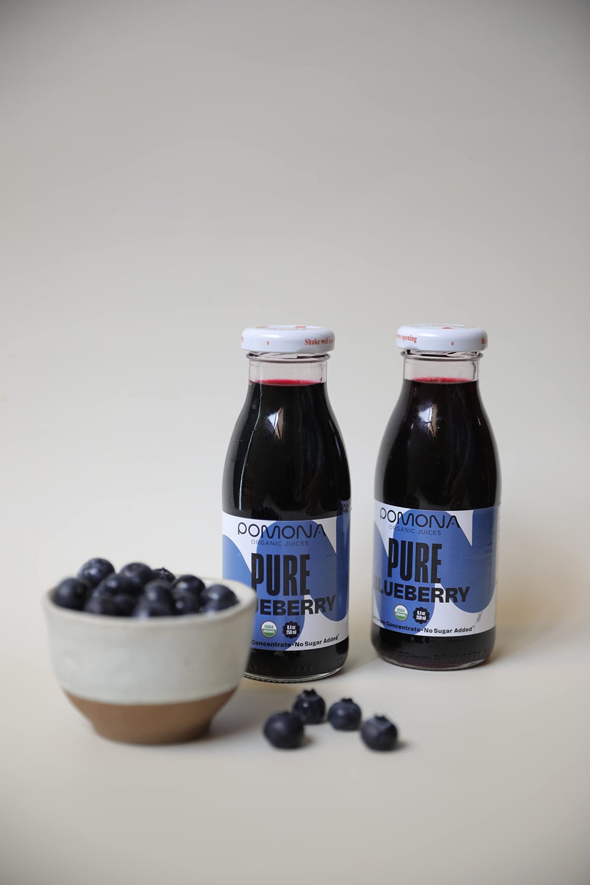 Pomona Organic Juices cold-pressed blueberry juice emphasizes not from concentrate and natural flavor.