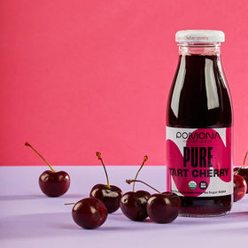 Pomona Organic Tart Cherry Juice being poured into a glass; great for smoothies.