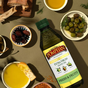 Unopened Pompeian Gourmet EVOO bottle on a kitchen shelf for everyday use.