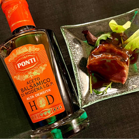 Ponti Rich & Creamy Balsamic Vinegar of Modena small oak barrels highlight traditional craft.