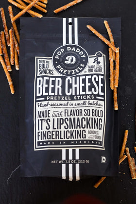 Pop Daddy crunchy pretzel sticks close-up showing satisfying crunch and cheesy notes.