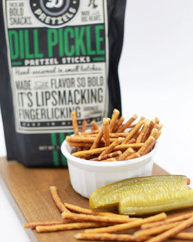 Pop Daddy three-pack of dill pickle pretzel sticks for convenient snacking.