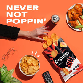 Popchips Barbeque chips on a picnic table outdoors.
