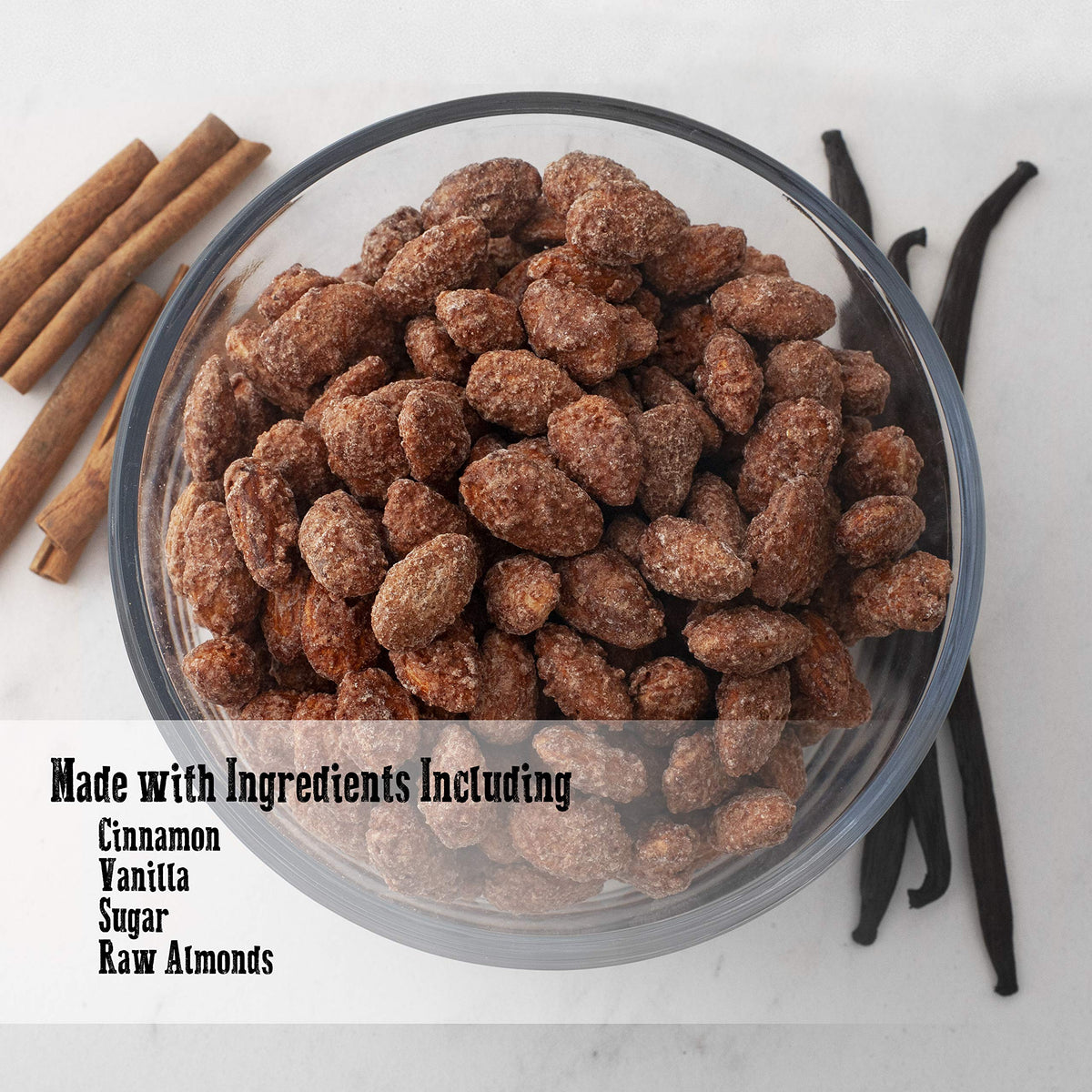 Coating closeup on Pop'N Popcorn Cinnamon Almonds showing vanilla glaze and cinnamon specks.