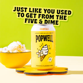 Popwell Cream Soda can pour highlights crisp flavor and natural caffeine for a midday boost.