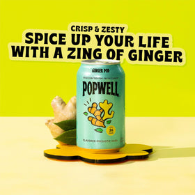 Pack of 12 Popwell Ginger Pop cans on a kitchen counter, perfect for lunch breaks.