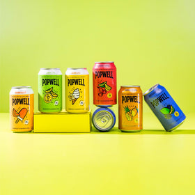 Popwell Tropical Mango soda on the dining table, versatile for everyday enjoyment