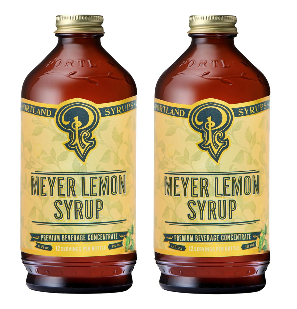 Portland Syrups Meyer Lemon Syrup bottle on bar, ideal for bright cocktails.