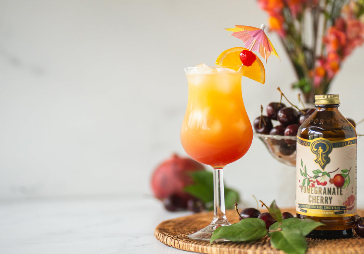 Portland Syrups Pomegranate Cherry mocktail in a tall glass.