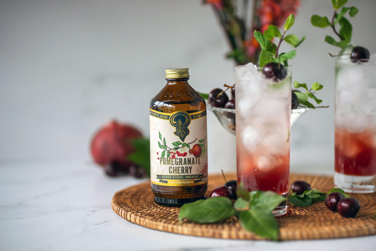 Vibrant Portland Syrups cocktail featuring pomegranate cherry syrup.