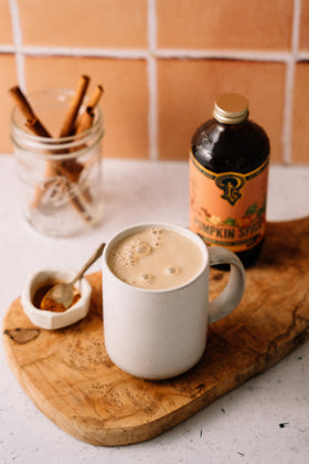 Portland Syrups Pumpkin Spice Syrup being poured to flavor coffee and desserts.