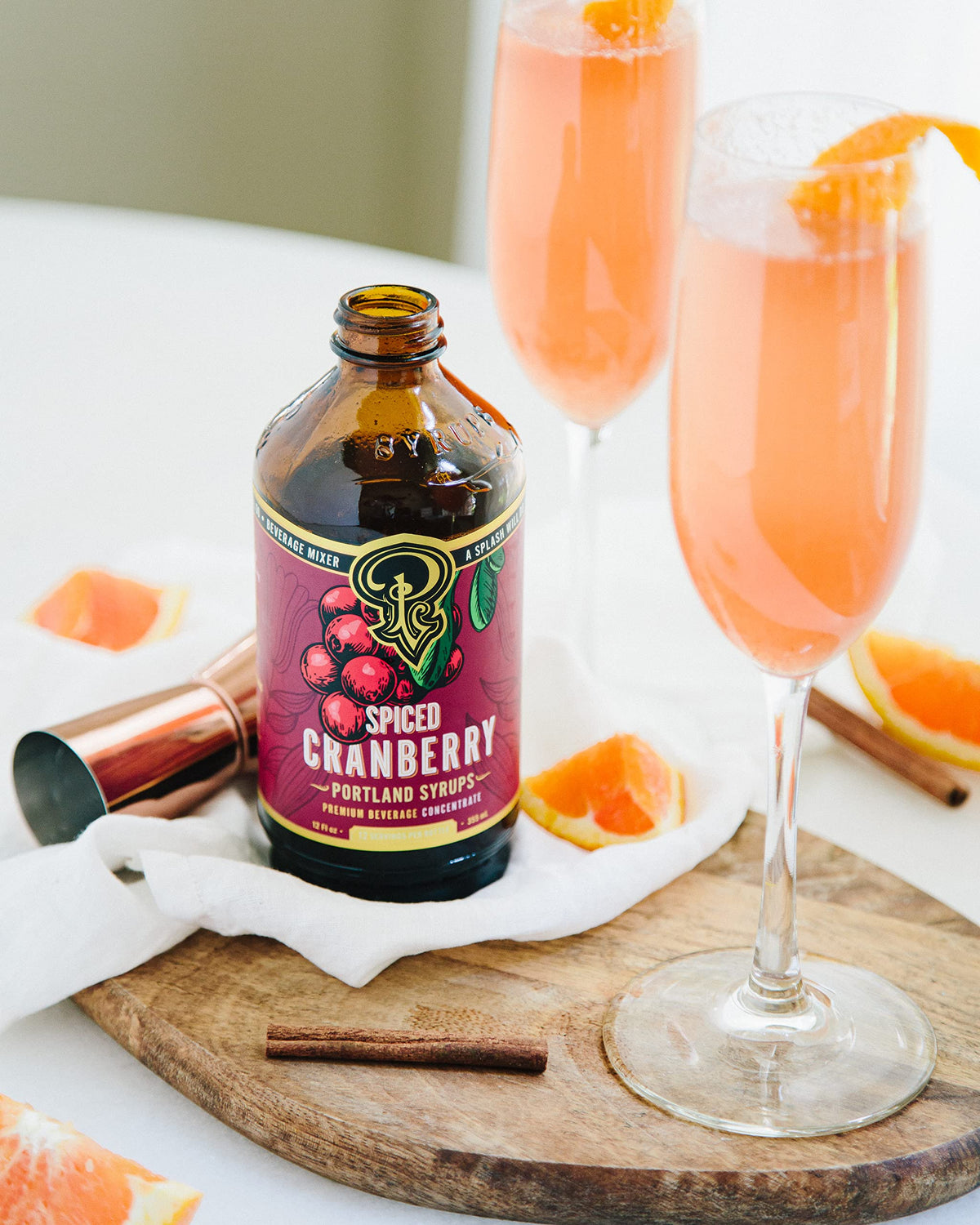 Portland Syrups Spiced Cranberry Syrup pouring into a glass for versatile drinks