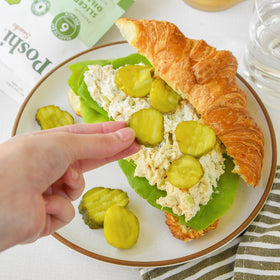 Poshi dill slices as a salad topper with vibrant crunch