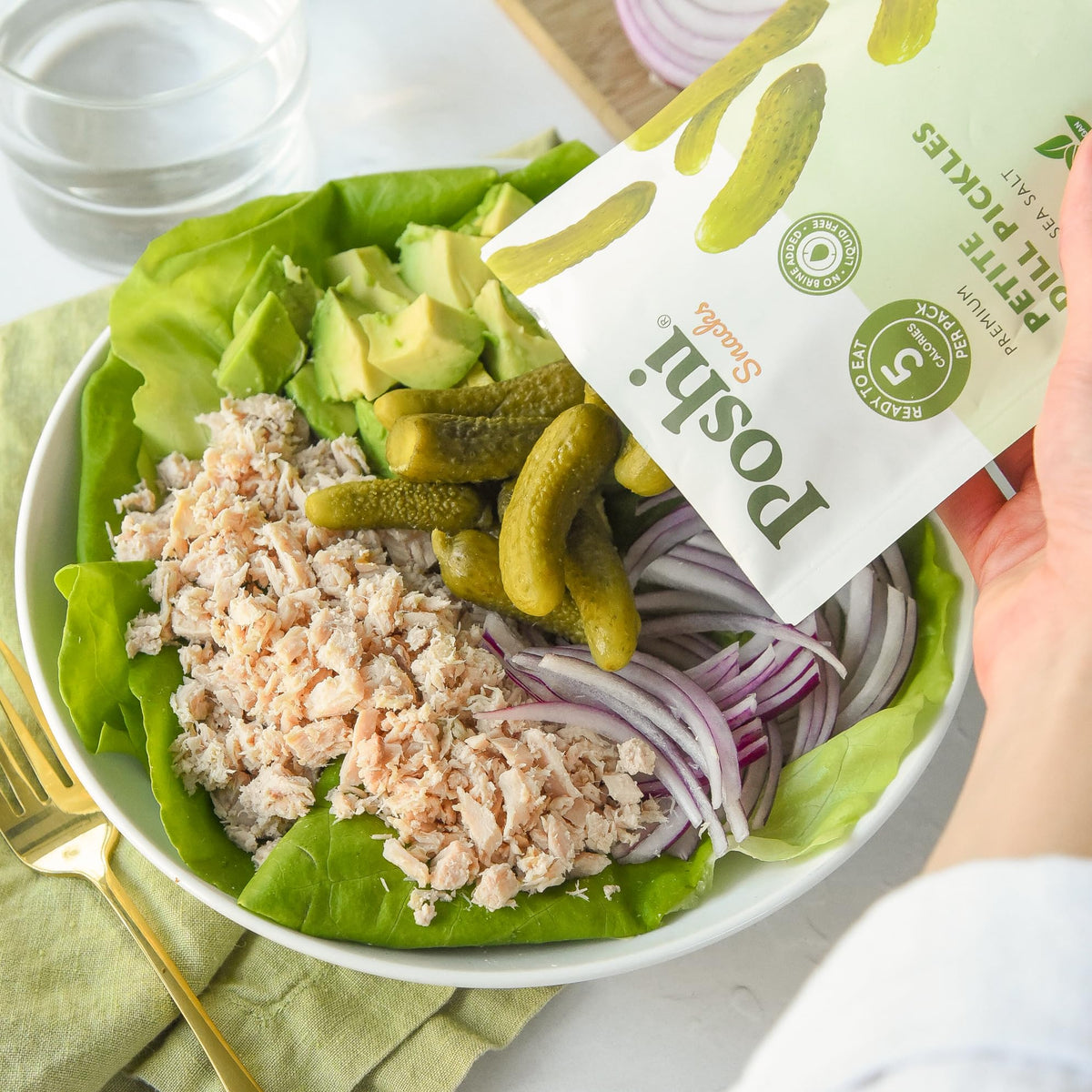 Poshi Petite Dill Pickles in a lunchbox offer a portable snack option
