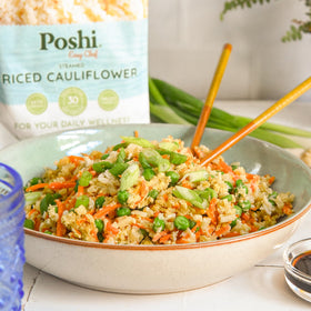 POSHI Riced Cauliflower kitchen setup with heat-ready rice as topper.
