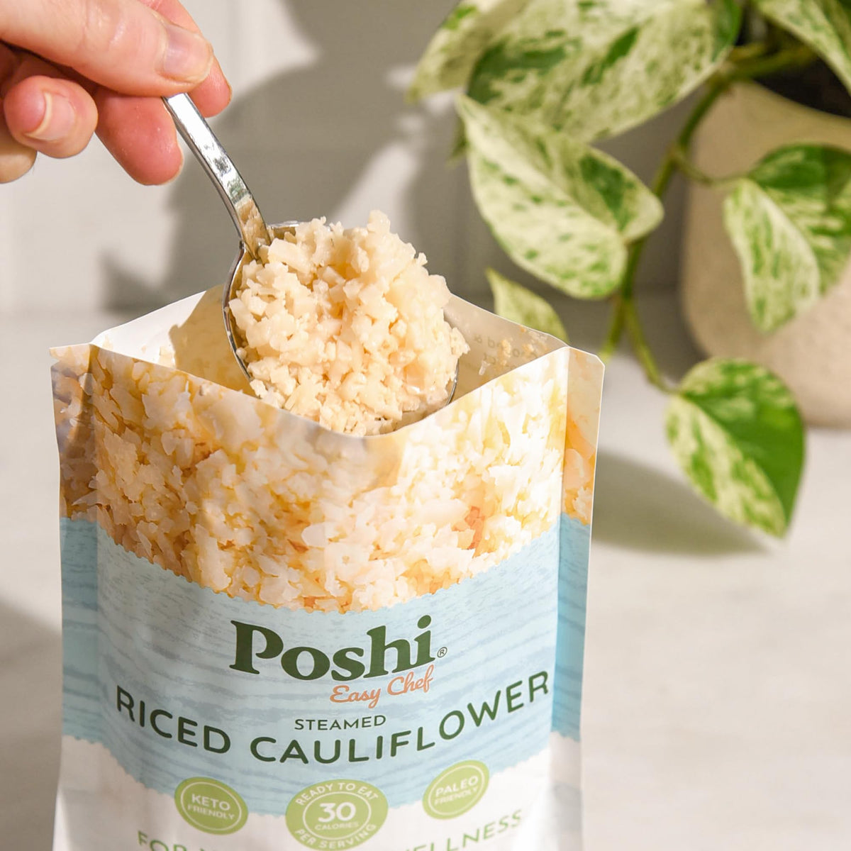 POSHI Riced Cauliflower pouch ready for microwave heating.