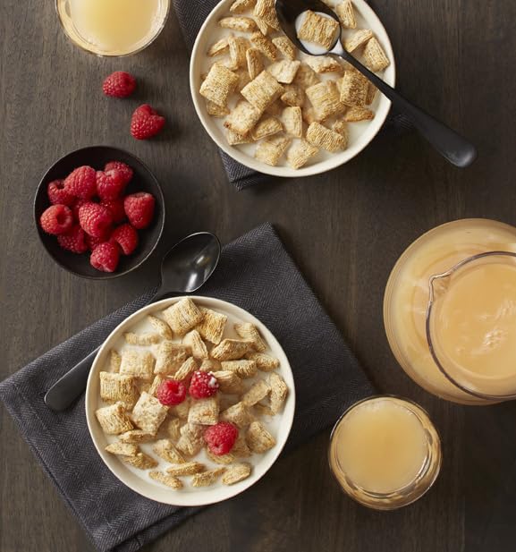 Bowl of Post Spoon Size Shredded Wheat with berries for fiber.