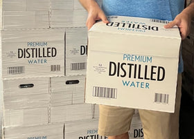 Premium Distilled Water 12-pack case ready for fridge, pantry, and on-the-go use.