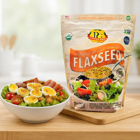 Premium Gold flax seeds beside yogurt and berries for tasty servings.