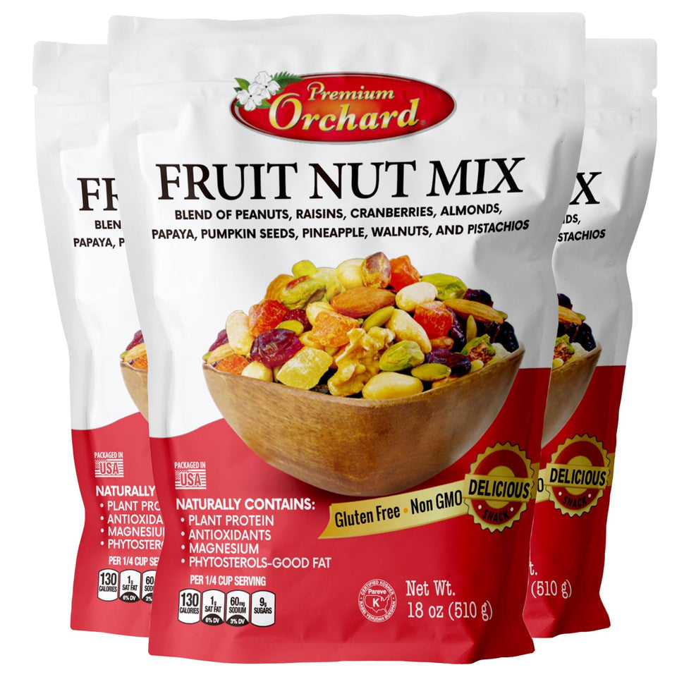 Premium Orchard fruit nut mix trail mix foreground with mixed nuts and dried fruit for energy.