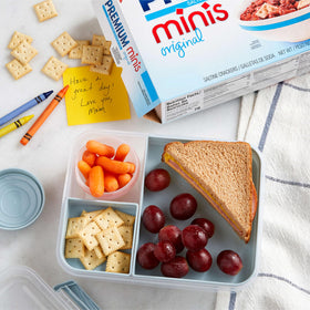 Topping ideas on a plate with mini crackers.