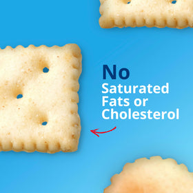 Premium Saltine Crackers in hand as a light, crunchy snack