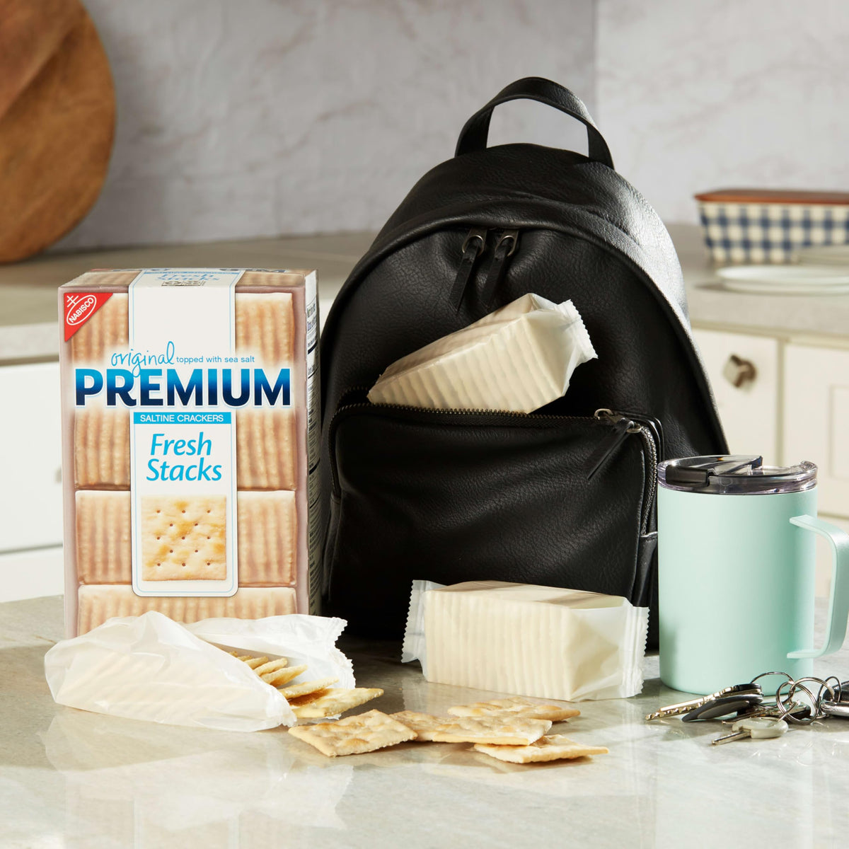 Premium travel-friendly saltine crackers in compact stacks for meals.