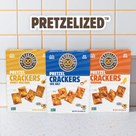 PRETZELIZED Snacks cheddar crackers close-up showing crisp cheese bite