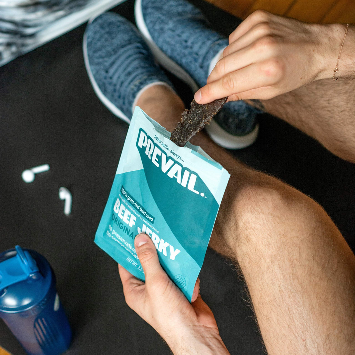 Prevail Jerky Original travel-ready pack clipped to a backpack.