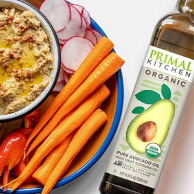 Primal Kitchen Avocado Oil 500ml dressing salad shot, perfect for vibrant vinaigrettes.