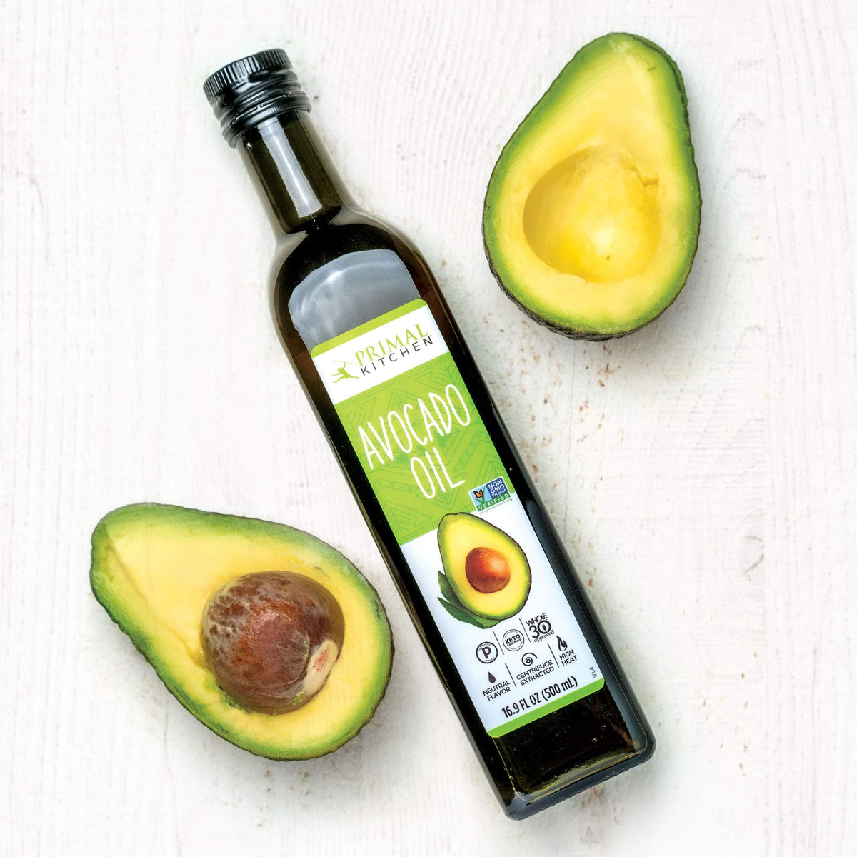 Primal Kitchen Avocado Oil pour demonstrating smooth texture for high-heat cooking.