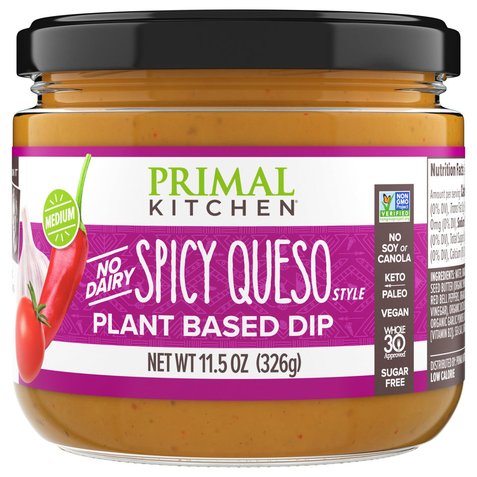Primal Kitchen Dip Queso Spicy bottle pour shows creamy, dairy-free queso for dipping.