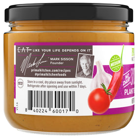 Primal Kitchen Dip Queso Spicy label closeup emphasizes keto-friendly, paleo-suitable.