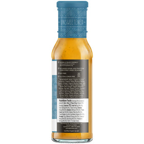 Primal Kitchen Golden BBQ sauce marinating chicken for rich Carolina-style flavor.