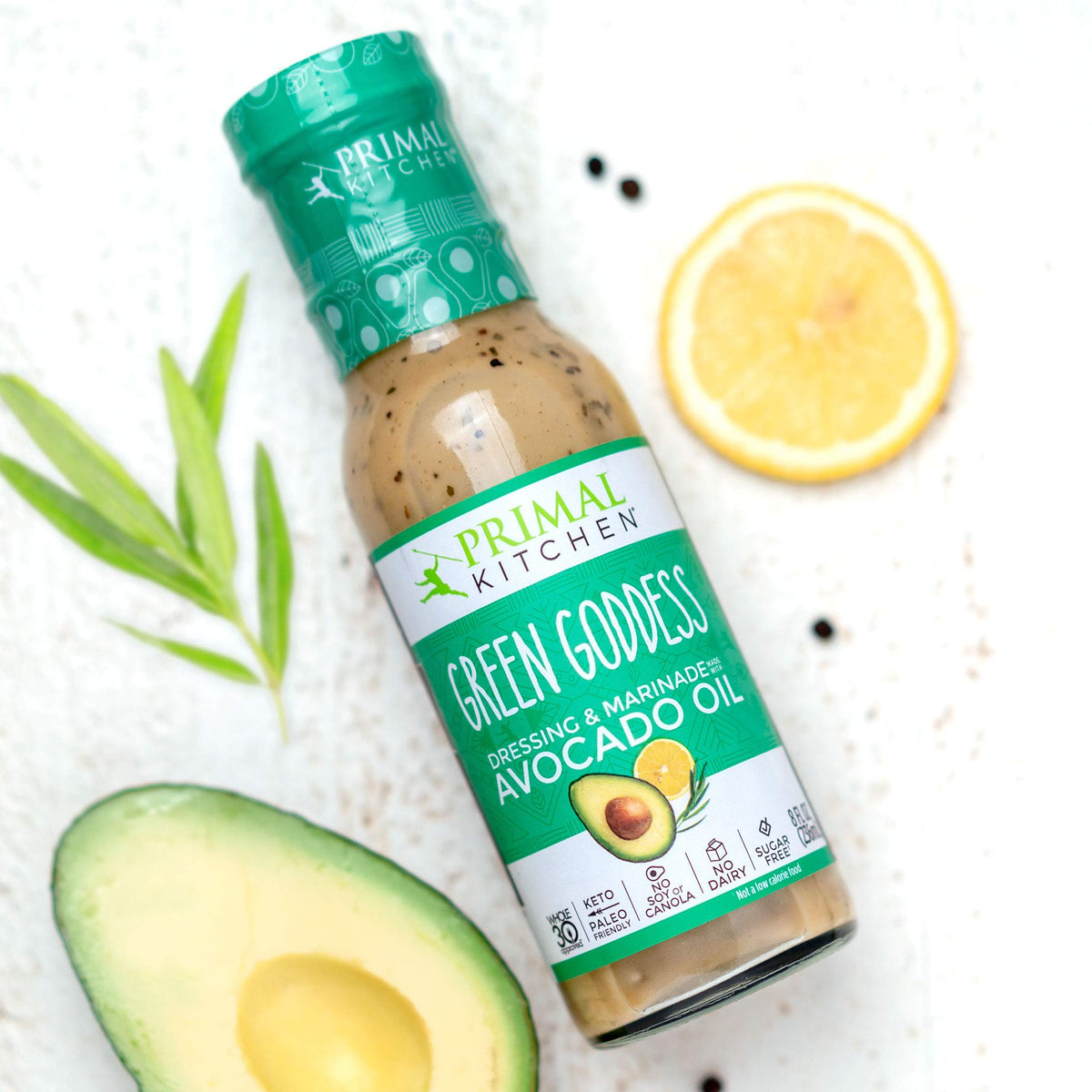 Primal Kitchen Green Goddess dressing bottle pour, herby finish perfect as dip or marinade.